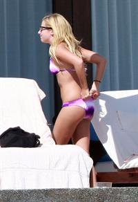 Ashley Tisdale in a bikini - ass