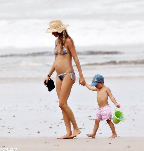 A pregnant Gisele Bundchen walking on the beach in Costa Rica - July 23, 2012.  She is pregnant with her second child