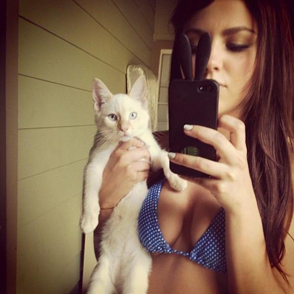 Val Keil in a bikini taking a selfie