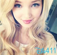 Dove Cameron taking a selfie