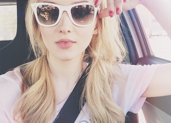 Dove Cameron taking a selfie