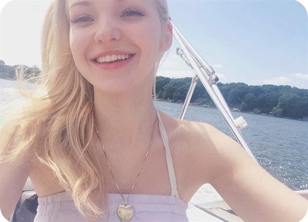 Dove Cameron taking a selfie