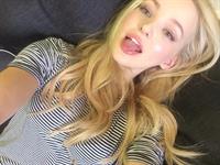 Dove Cameron taking a selfie