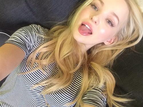 Dove Cameron taking a selfie