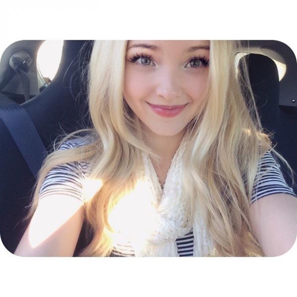 Dove Cameron taking a selfie