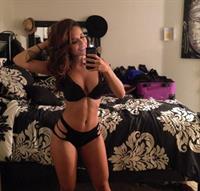 Tianna Gregory in a bikini taking a selfie