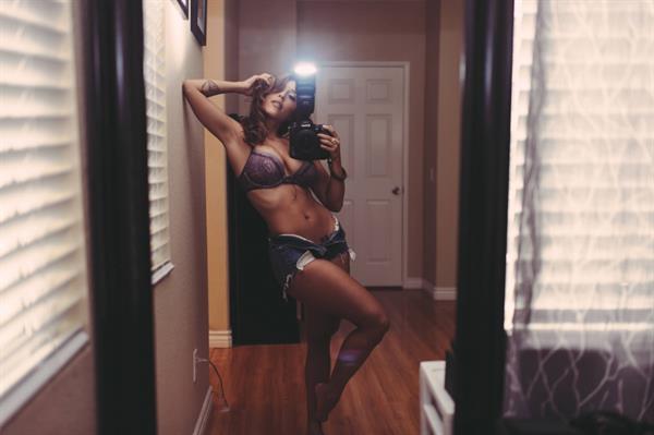 Tianna Gregory in a bikini taking a selfie