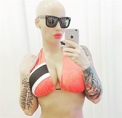 Amber Rose in a bikini taking a selfie