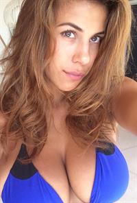 Devin Brugman in a bikini taking a selfie