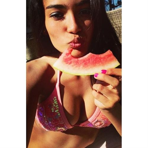 Kelly Gale in a bikini taking a selfie