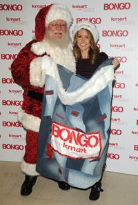 Audrina Patridge poses with Santa Claus