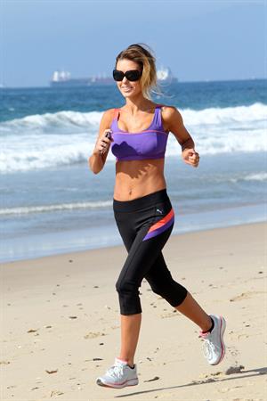 Audrina Patridge running on the beach in the South Bay