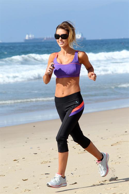 Audrina Patridge running on the beach in the South Bay