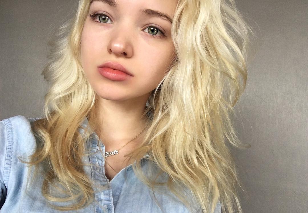Dove Cameron taking a selfie