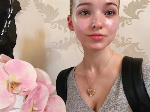Dove Cameron taking a selfie