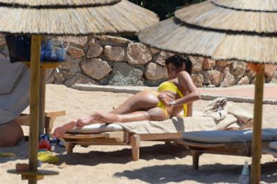Aida Yespica - Yellow bikini candids in Sardinia on June 18, 2012
