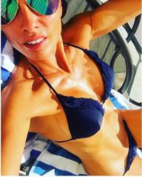 Melanie Sykes in a bikini taking a selfie