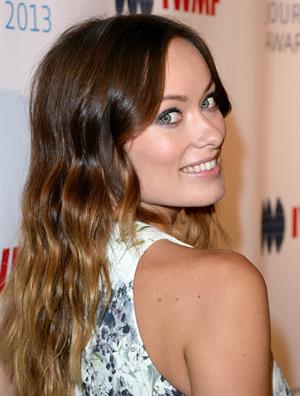 Olivia Wilde debuts her small baby bump while attending the 2013 International Women’s Media Foundation’s Courage in Journalism Awards at the Beverly Hills Hotel on Tuesday (October 29, 2013) in Beverly Hills, Calif.