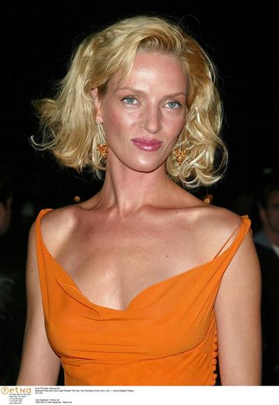 Uma Thurman in an orange dress