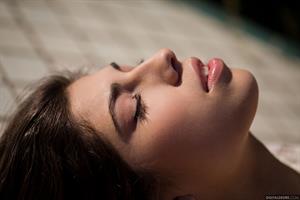 Ava Taylor in lingerie by the pool