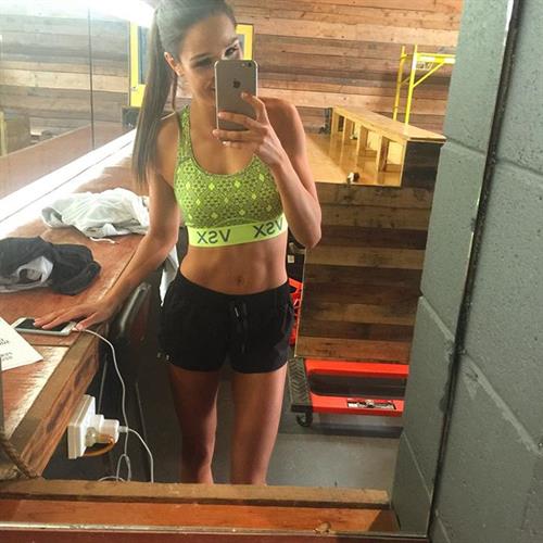 Kayla Itsines taking a selfie