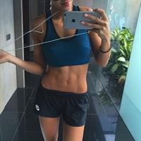 Kayla Itsines taking a selfie
