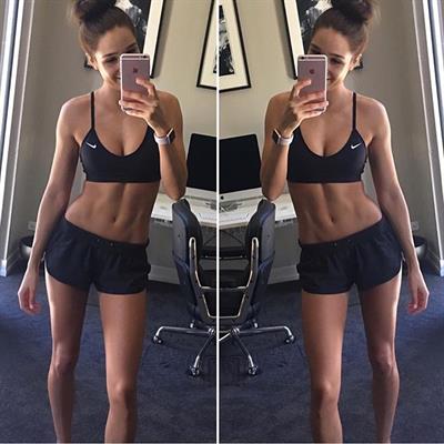 Kayla Itsines taking a selfie