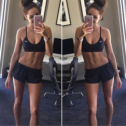 Kayla Itsines taking a selfie