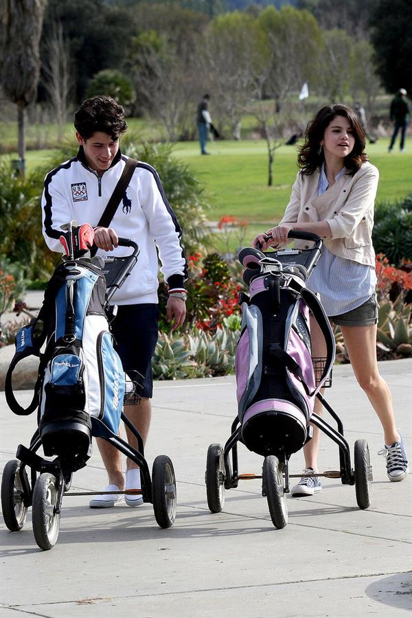 Selena Gomez golfing on February 2, 2010