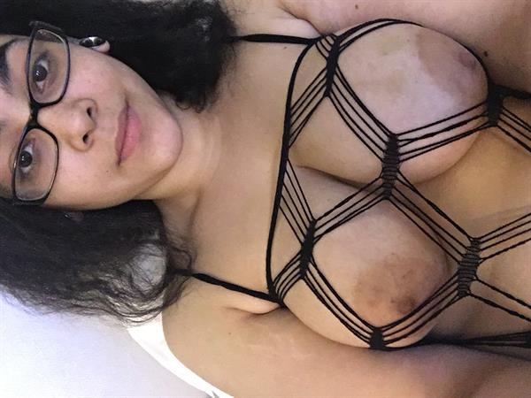 Nikki Jay taking a selfie and - breasts