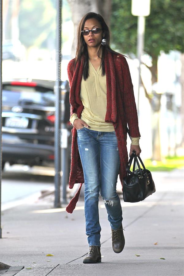 Zoe Saldana out and about in West Hollywood wearing a long red sweater coat January 19-2012 