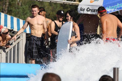 Katy Perry talks with a group of her friends after spending the afternoon at Raging Waters in San Dimas, California on August 12, 2012