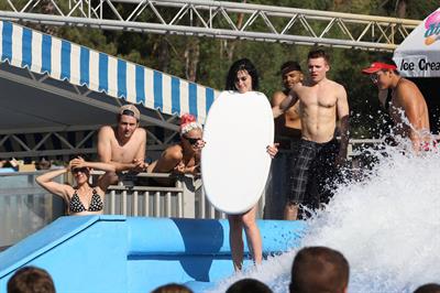 Katy Perry talks with a group of her friends after spending the afternoon at Raging Waters in San Dimas, California on August 12, 2012