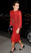 Lea Michele outside in a red dress at night