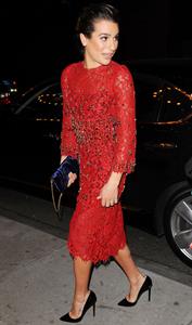 Lea Michele outside in a red dress at night