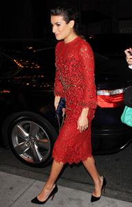Lea Michele outside in a red dress at night