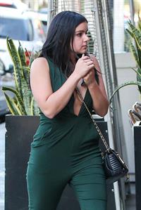 Ariel Winter shows cleavage while on a walk
