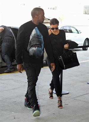 Kim Kardashian and Kanye West JFK airport in New York - 09 August 2012 