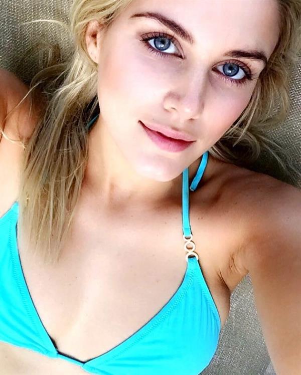 Ashley James in a bikini taking a selfie