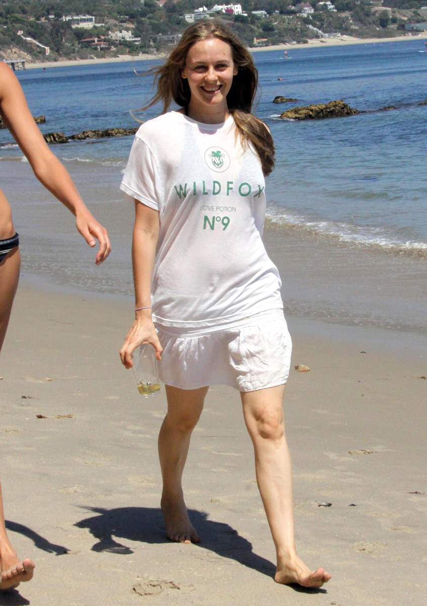 Alicia Silverstone walking on the beach in Malibu. 