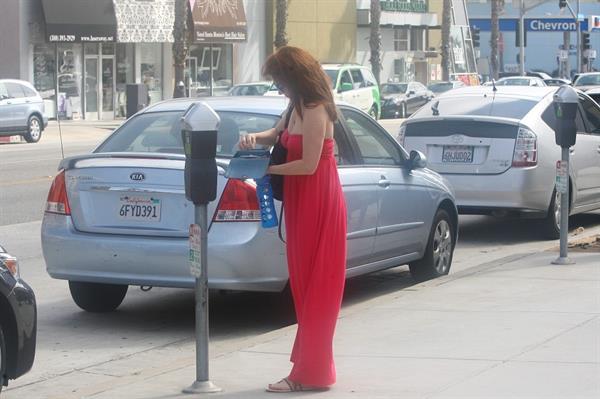 Alyson Hannigan in a red dress in Santa Monica on August 20, 2012