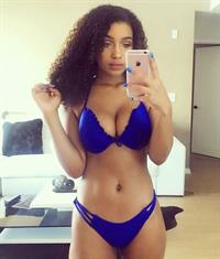 Corie Rayvon in a bikini taking a selfie