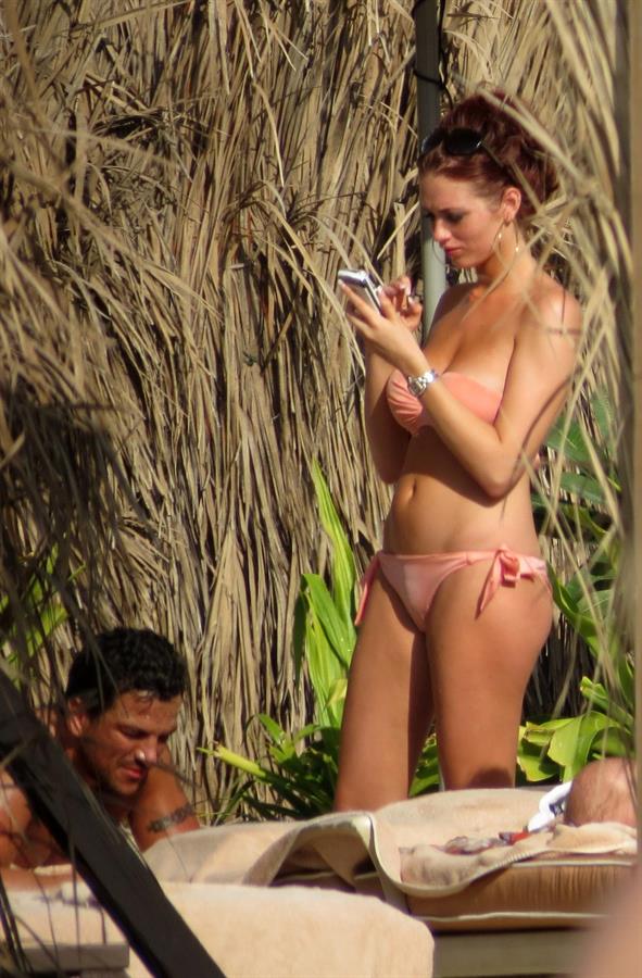 Amy Childs sunbathing with Peter Andre in Dubai on January 3, 2012