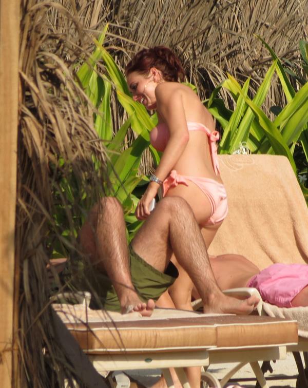 Amy Childs sunbathing with Peter Andre in Dubai on January 3, 2012