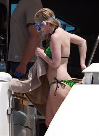Avril Lavigne in a green bikini in Cabo, Mexico on July 27, 2012