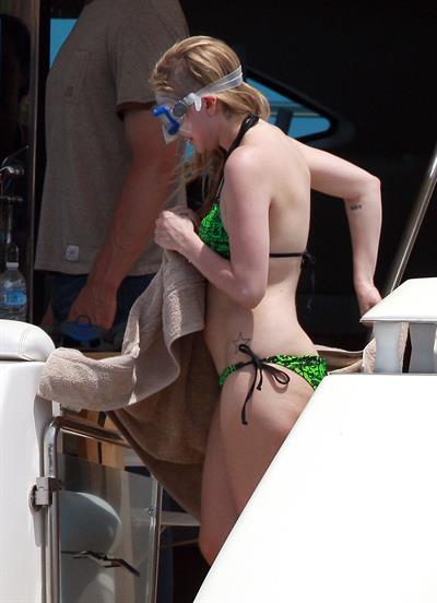 Avril Lavigne in a green bikini in Cabo, Mexico on July 27, 2012