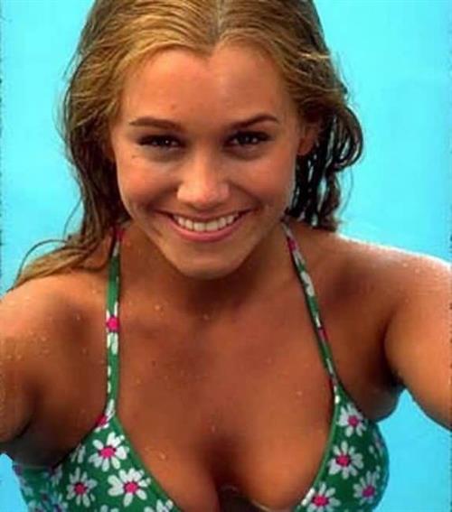 Christine Taylor in a bikini taking a selfie