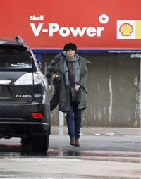 Dannii Minogue - Pictured getting a little wet while filling up on petrol - 09th August 2012