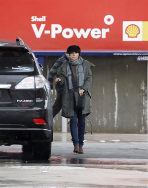 Dannii Minogue - Pictured getting a little wet while filling up on petrol - 09th August 2012