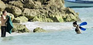 Demi Lovato and her bodyguard are spotted on the beach in Barbados April, 16 2013 